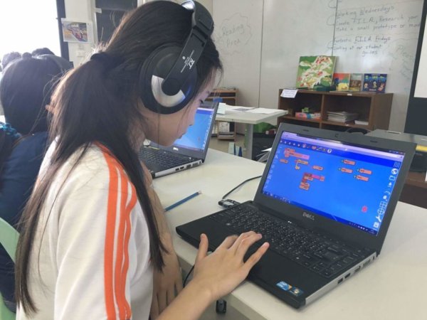 Student at Thailand school works on Music Blocks project.